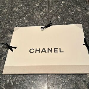 Chanel logo embossed ribbon tie portfolio/document jacket/folder. Woven binding.